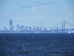 Actual zoomed in view of NYC and the new Freedom Tower from Keansburg beach just right across the street!